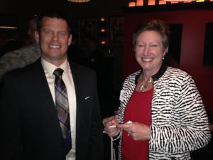 An attendee standing with Jeanne Robinson