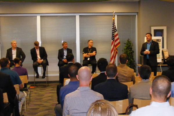 Panelists in the front of the room