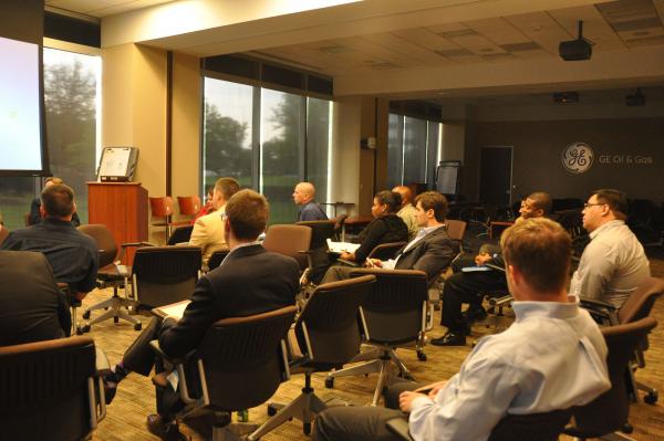 attendees sitting and listening to speaker