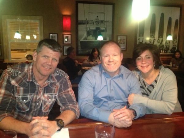 Three of the participants sitting at the bar