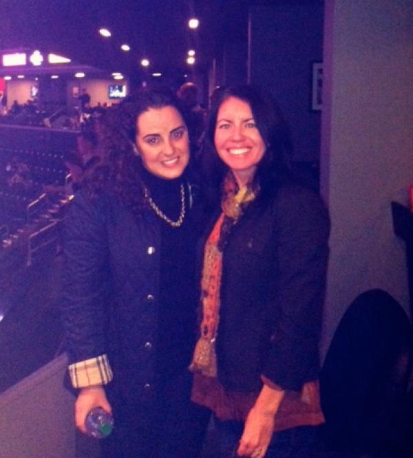 two women pose for a photo together